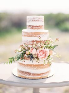 naked wedding cake with flowers